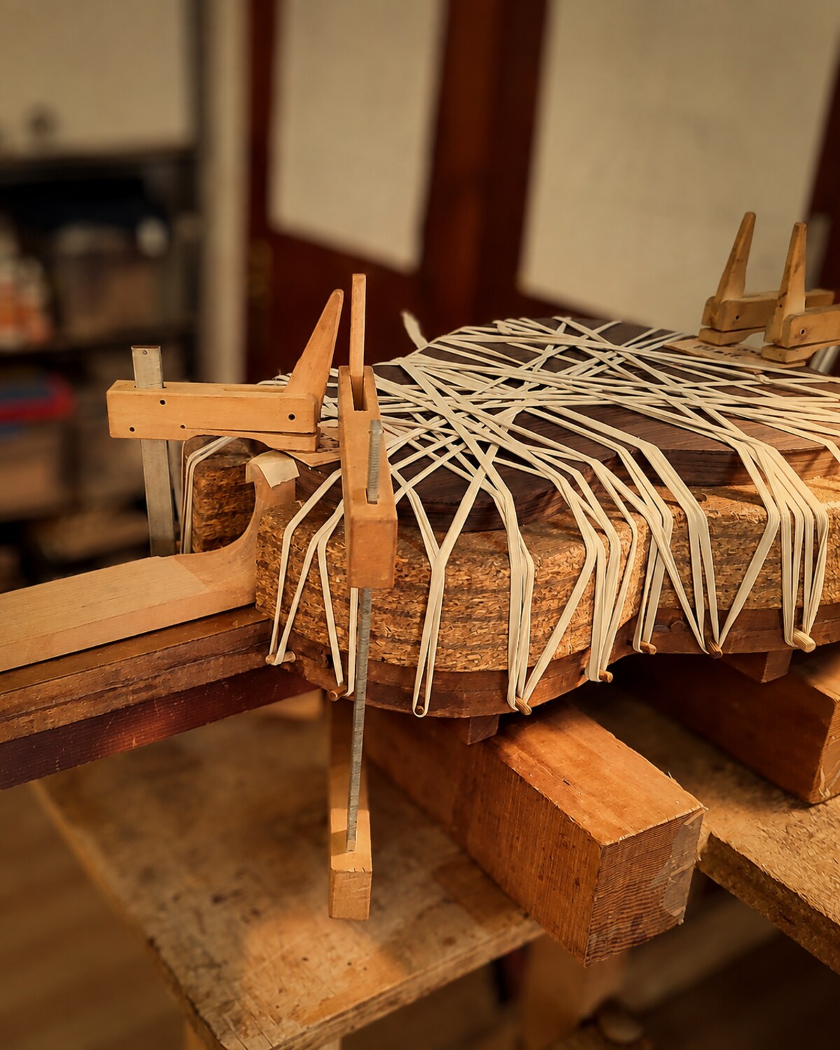 Classical guitar body being closed using traditional rope binding