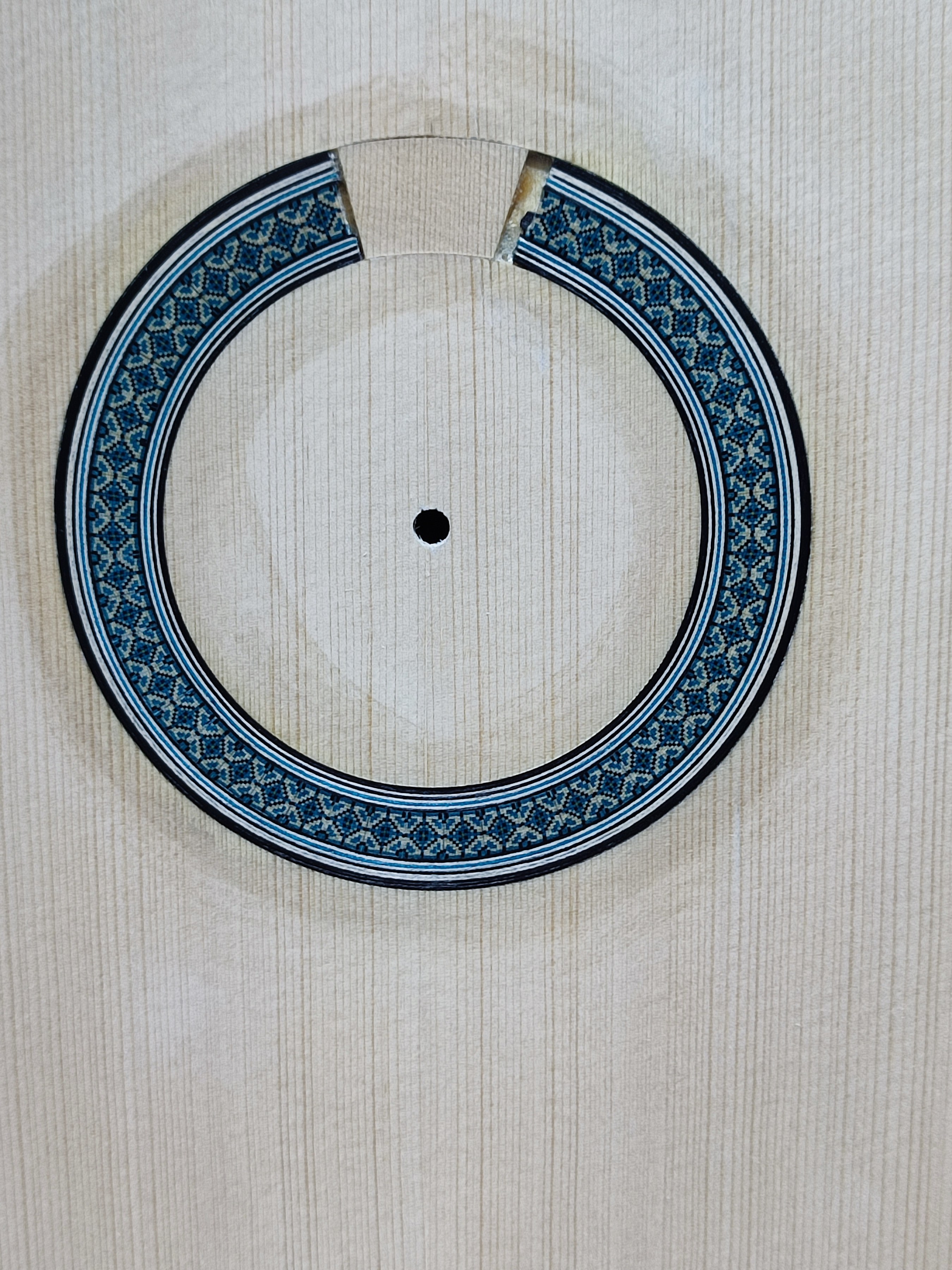 The rosette — hand-fitted to the soundboard